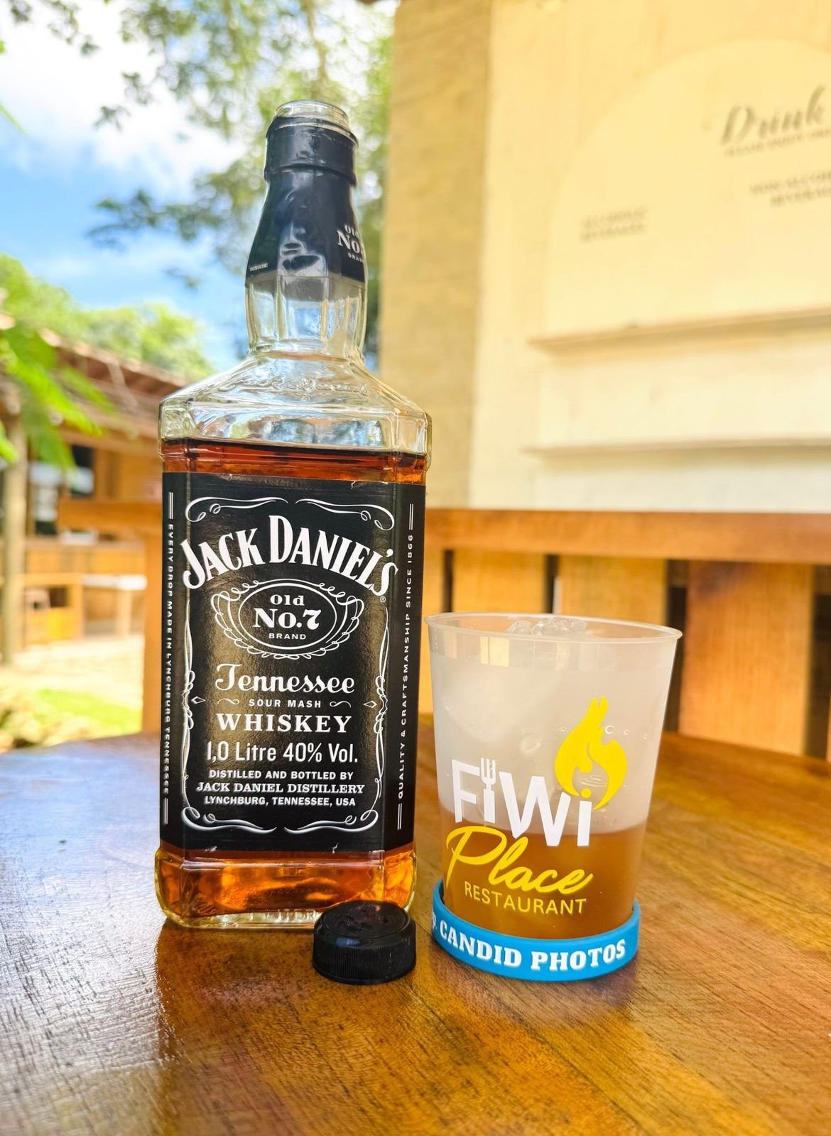 A drink in a FiWi Place cup at the bar